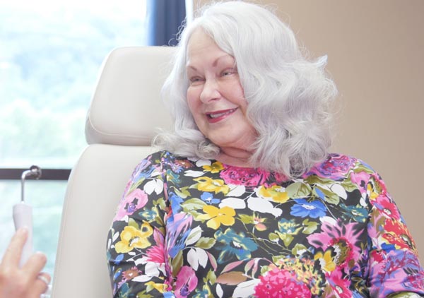 A smiling patient ready to receive a JUVÉDERM treatment at The Facial Center in Charleston, WV