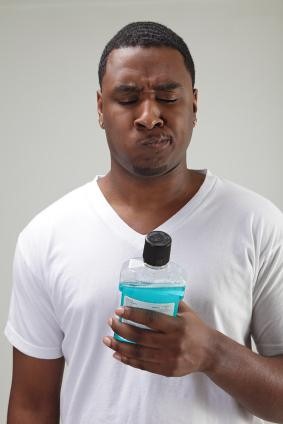 A man with mouthwash The Facial Center in Charleston, WV