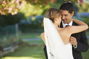 Bride and groom holding each other